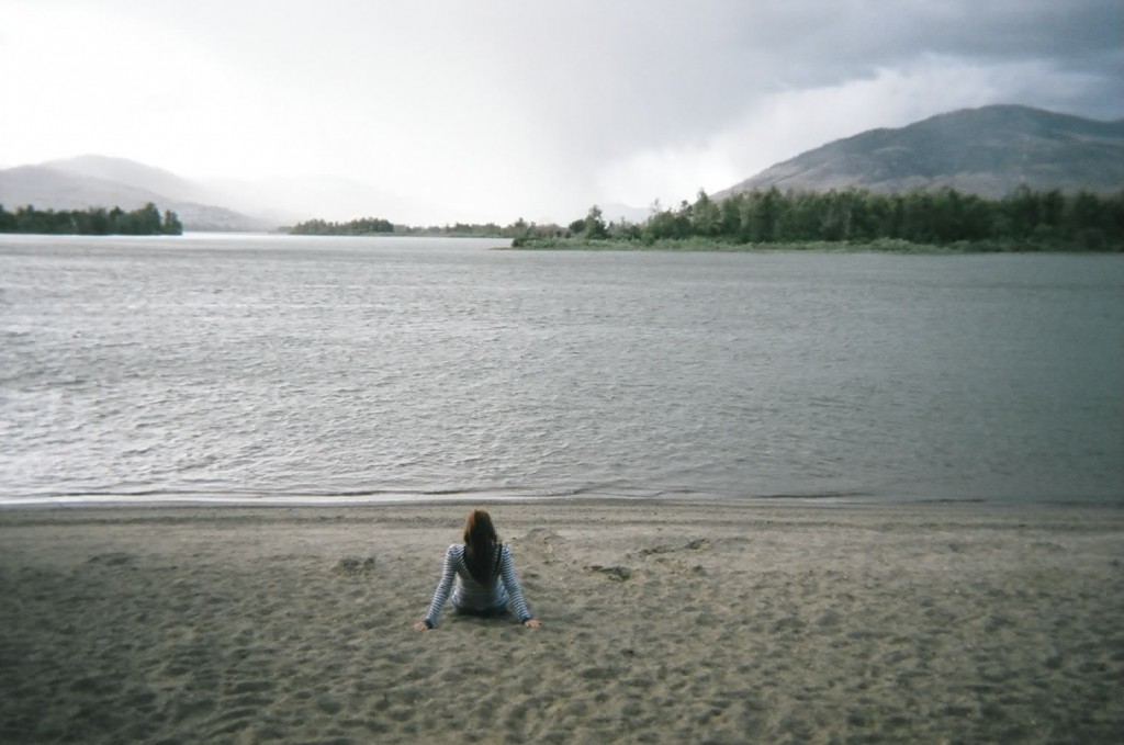 This is me sitting at Riverside Park near the beach in front of the river. It means to come to Kamloops and to have peace, of so many things, so many things. It was a new start, so it was something new